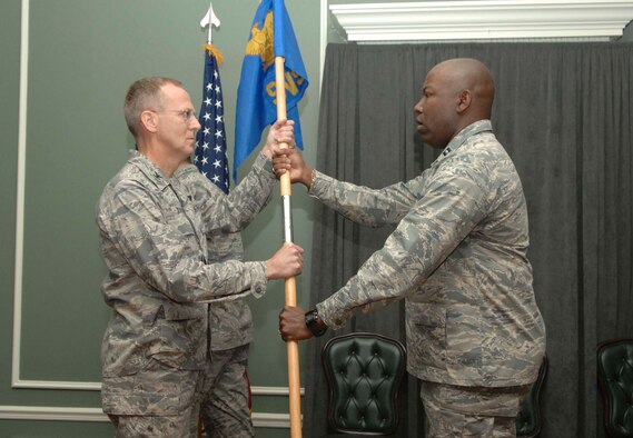 SHAW AIR FORCE BASE, S.C.-- Capt. Kenneth Marshall (right) relinquishes command of the 20th Services Squadron to Col. Francis Xavier, 20th Mission Support Group commander, for deactivation Nov. 5. The 20th SVS and the 20th Mission Support Squadron have been deactivated and combined to form the 20th Force Support Squadron (Provisional). (U.S. Air Force photo/Staff Sgt. Henry Hoegen Jr.)