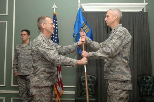 SHAW AIR FORCE BASE, S.C.-- Lt. Col. Jimmie Sullivan (right) assumes command of the 20th Force Support Squadron (Provisional) from Col. Francis Xavier, 20th Mission Support Group commander, Nov. 5. The 20th Services Squadron and the 20th Mission Support Squadron have been deactivated and combined to form the 20th FSS. (U.S. Air Force photo/Staff Sgt. Henry Hoegen Jr.)