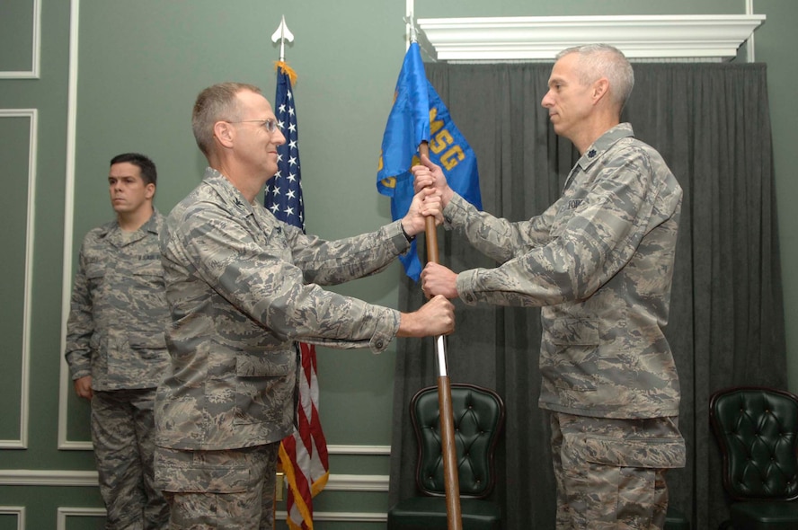 SHAW AIR FORCE BASE, S.C.-- Lt. Col. Jimmie Sullivan (right) assumes command of the 20th Force Support Squadron (Provisional) from Col. Francis Xavier, 20th Mission Support Group commander, Nov. 5. The 20th Services Squadron and the 20th Mission Support Squadron have been deactivated and combined to form the 20th FSS. (U.S. Air Force photo/Staff Sgt. Henry Hoegen Jr.)