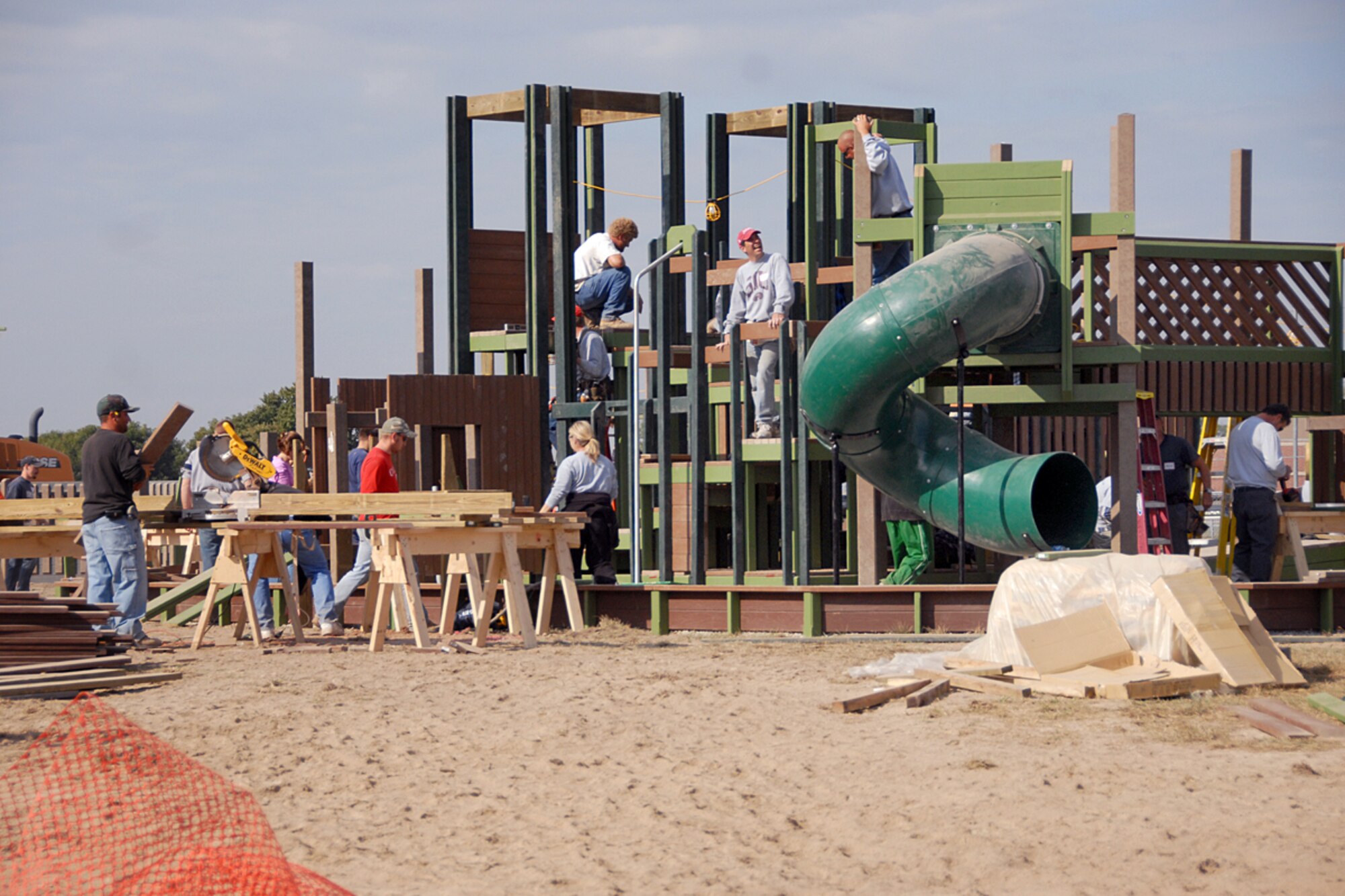 Volunteers from Joint Total Force Scott and members of the local community help build Swansea Kingdom, a community playground designed by kids and built by volunteers.  