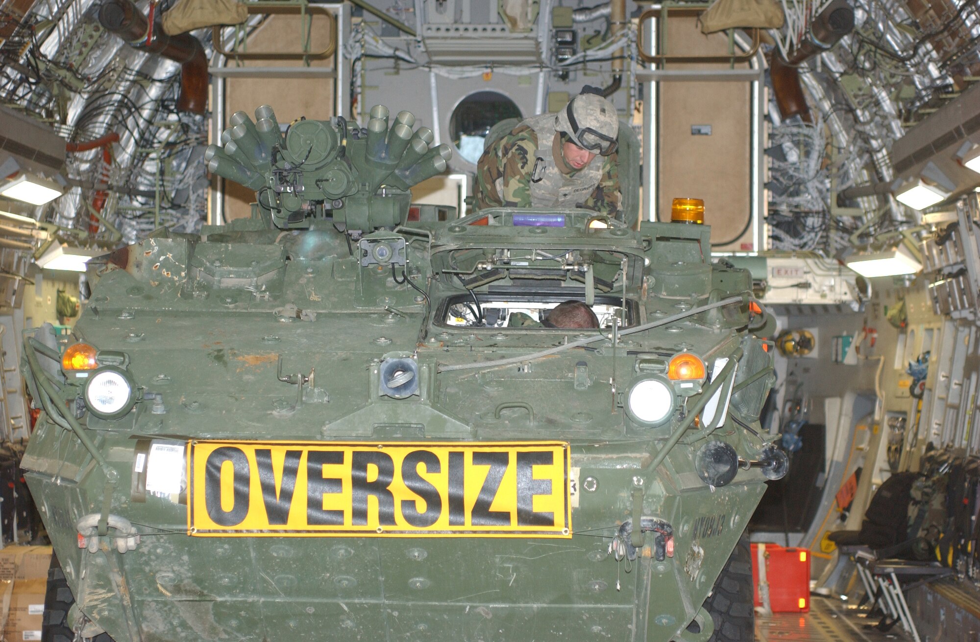 ELMENDORF AIR FORCE BASE, Alaska-- Soldiers from 1st Battalion, 24th Infantry Regiment, 1st Stryker Brigade Combat Team, 25th Infantry Division, start securing a Stryker inside a C-17 aircraft during a deployment exercise at Eielson Air Force Base Oct. 30. (U.S. Army photo by Spc. Vincent Fusco) (Released)