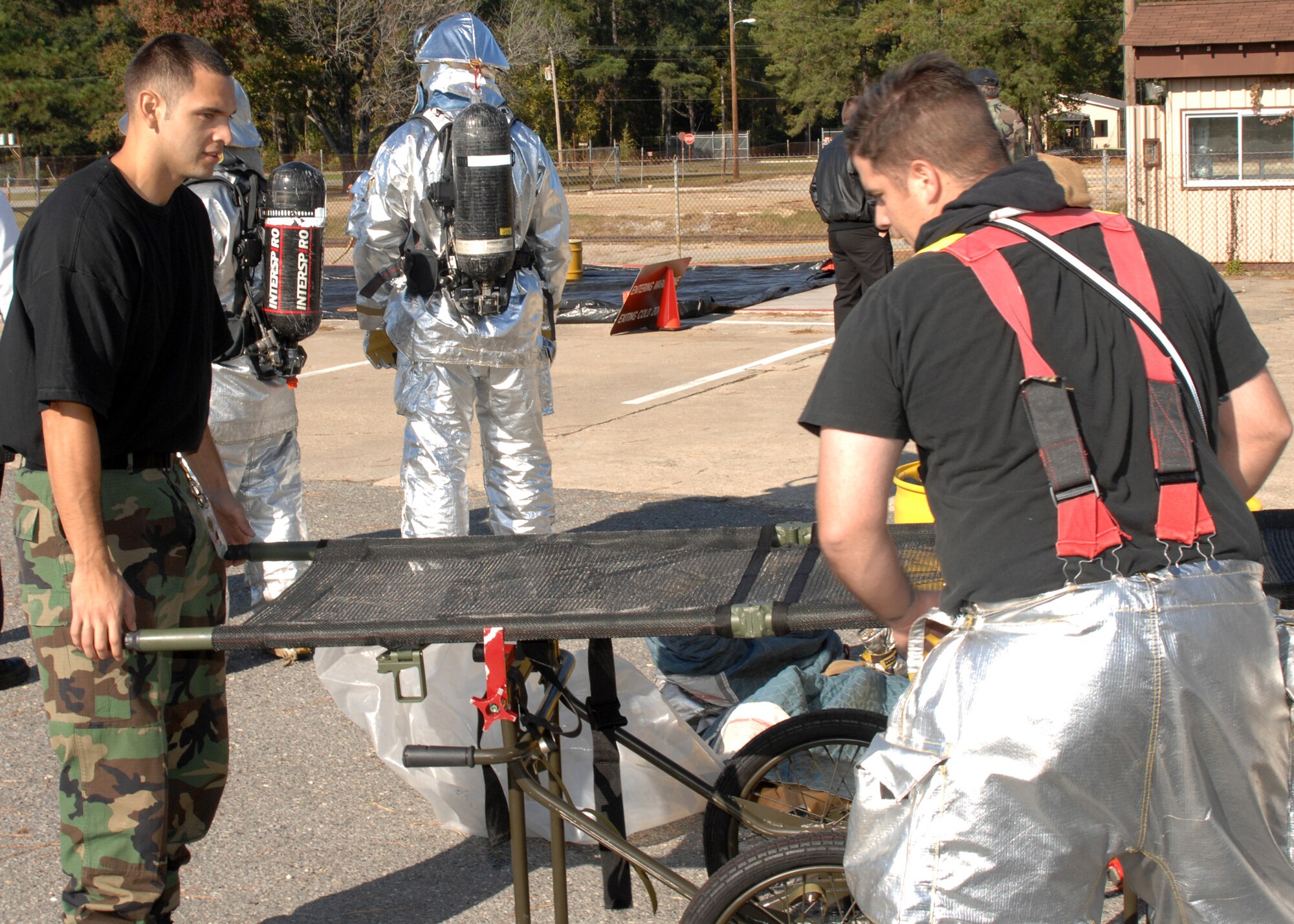 SEYMOUR JOHNSON AIR FORCE BASE N.C. - Staff Sergeants Reuben Prieto and Travis Buck, 4th Civil Engineer Squadron, set up equipment to use during an Orbit Comet exercise November 3.  Orbit Comet is a regional exercise which tests the response of local authorities and wing personnel during a terrorist attack. (US Air Force photo by Senior Airman Chad Trujillo)