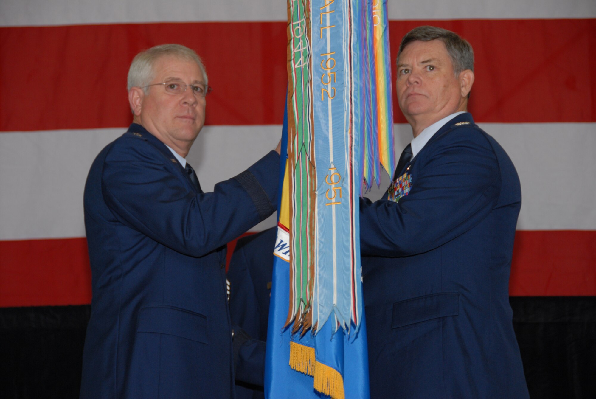Brig. Gen. Riley Porter (left), Arkansas Air National Guard commander, Nov. 3 handed over command of the 189th Airlift Wing to Col. Jim Summers. The colonel, a former Marine helicopter pilot and Coast Guard C-130 pilot, has more than 9,100 hours in military aircraft. (Photo by Senior Airman Julian Johnson)
