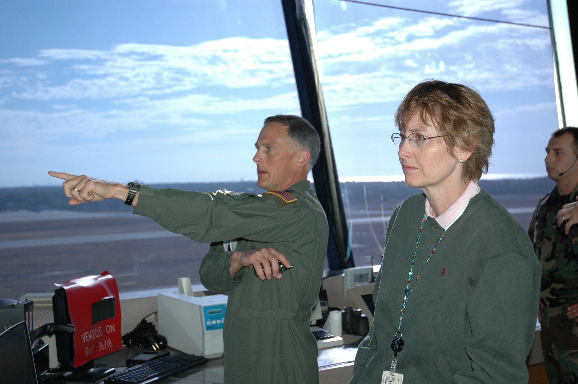 Col. Dennis Pannell, 1st Special Operations Group commander, points out various aircraft on the flightline from the air traffic control tower to Dr. Karen Chapman, director of the Okaloosa County Health Department and 1st Special Operations Medical Group honorary commander. (U.S. Air Force photo by Amy Oliver)