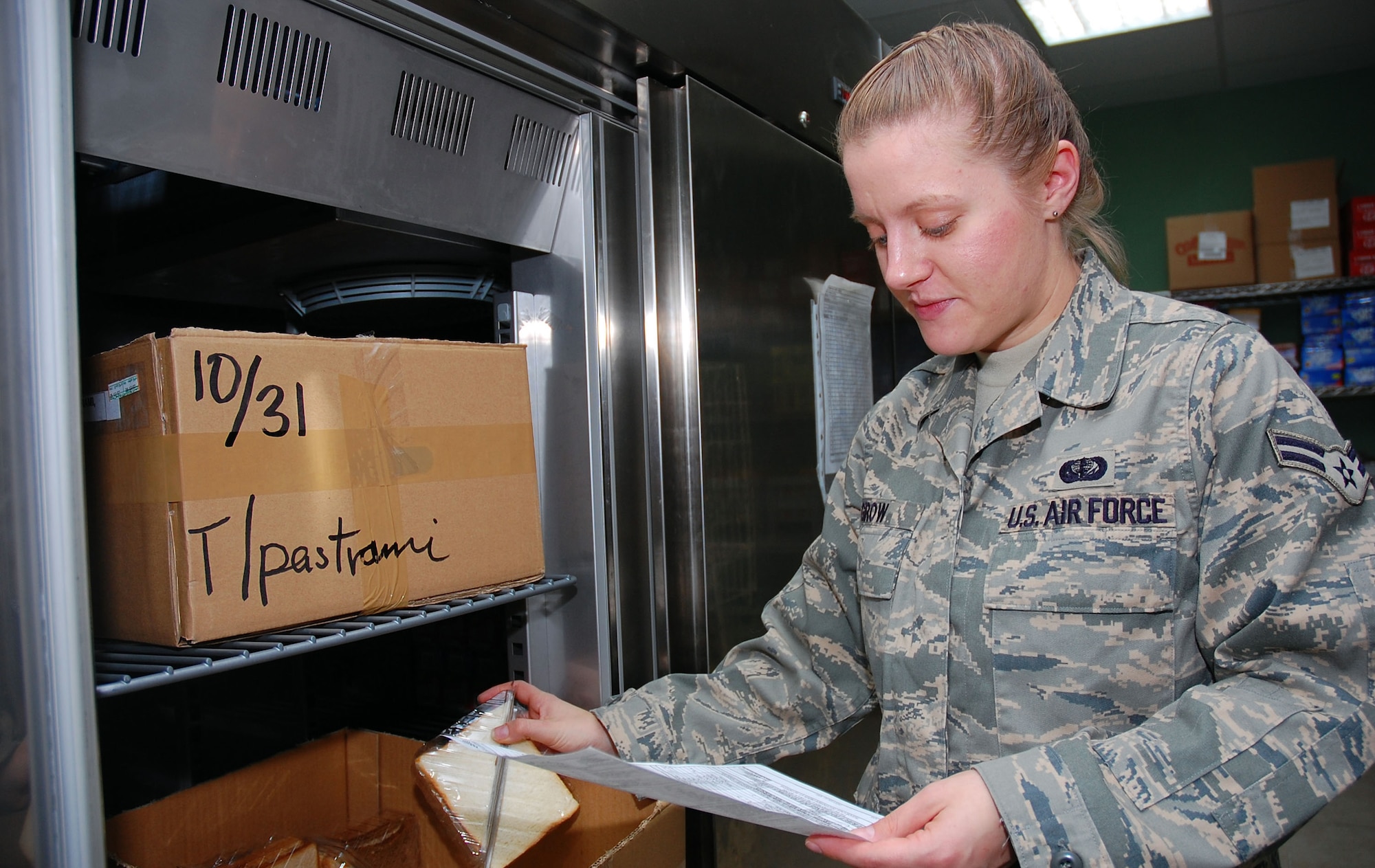 Airman 1st Class Kristen Grow, 386th Expeditionary Services Squadron food services specialist, prepares a flight meal inventory Nov. 2 here.  Airman Grow is deployed from Barksdale Air Force Base, La.  (U.S. Air Force photo/Staff Sgt. Tia Schroeder)