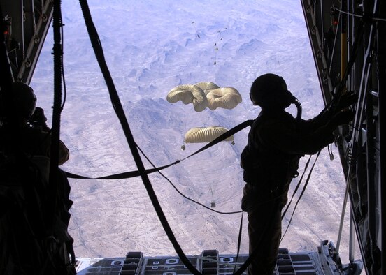 AFGHANISTAN - An Air Force loadmaster secures the ramp of a C-130 Hercules after dropping critical supplies to replenish Coalition ground forces.  Airdrops provide re-supply to forward operating locations in Afghanistan supporting Operation Enduring Freedom.  (Air Force photo by Senior Master Sgt. Andy Huneycutt)