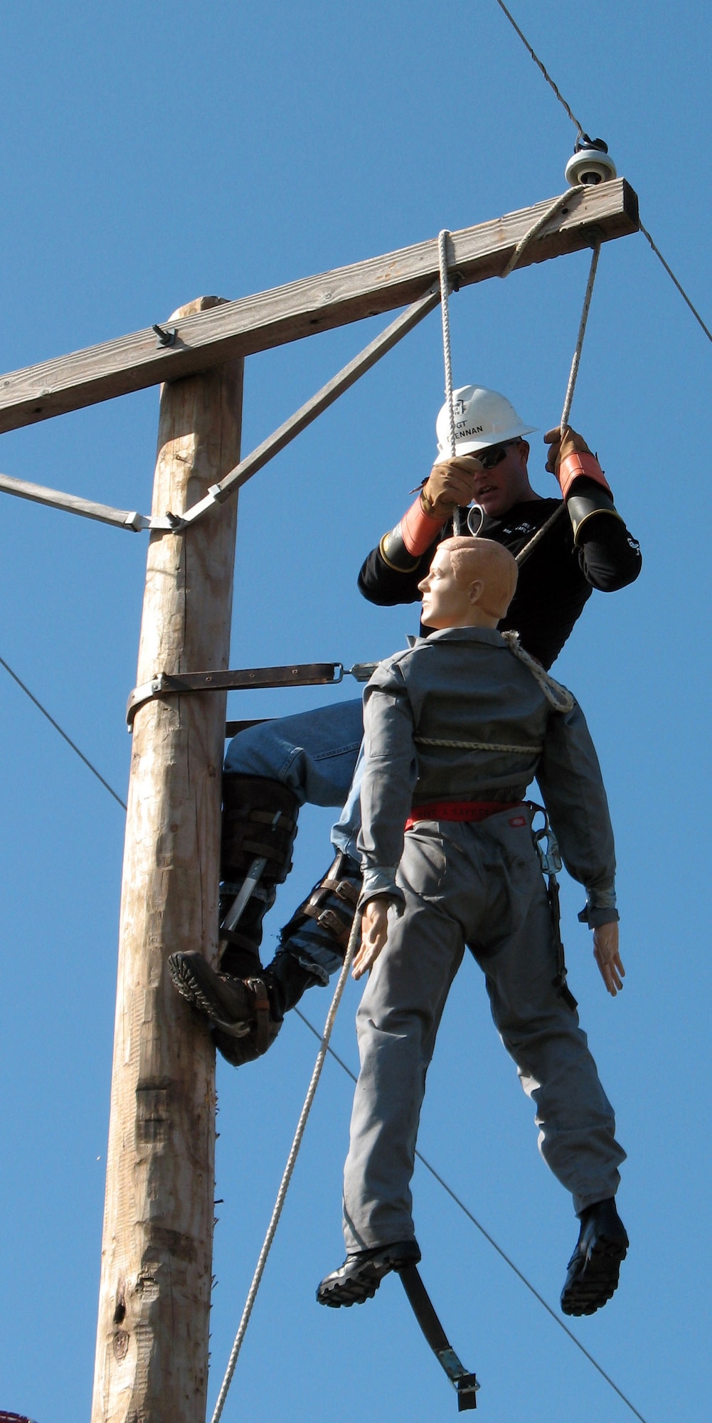 Tech Sgt. Brian Drennan, an electrical systems instructor with the 366th Training Squadron, competes in the Hurtman Rescue event at the 24th Annual International Lineman's Rodeo and Expo at Overland Park, Kan., Oct 27. The Sheppard team placed second in the military category. (Photo courtesy of Major Majken Tutty)
