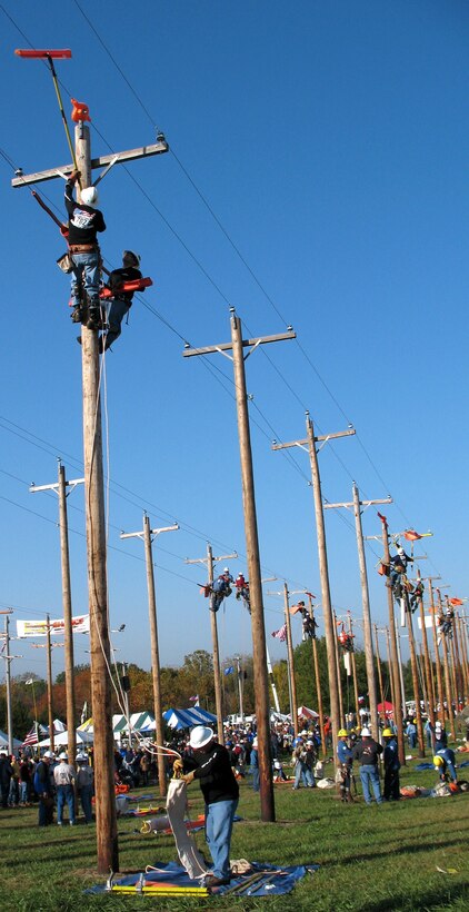 Electrical system instructors from the 366th Training Squadron compete in the Insulator Change event at the 24th Annual International Lineman's Rodeo and Expo at Overland Park, Kan., Oct 27. The Sheppard team placed second in the military category. (Photo courtesy of Major Majken Tutty)