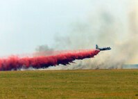 July - Sep 2000 -- Air Force Reserve firefighting aircraft and aircrews quenched wildfires in California, Idaho and Montana, flying C-130s equipped with Modular Airborne Fire Fighting Systems. Here, an Air Force Reserve C-130 Hercules MAFFS aircraft assigned to the 302nd Airlift Wing, Peterson Air Force Base, Colo., drops fire retardant chemicals on the "Big Crow" wildfire in southwestern Idaho. The 302nd, along with the 146th AW, California Air National Guard, deployed to Boise, Id., to contain wildfires there before they could become major fires. The 302nd again fought wildfires in California in 2007.