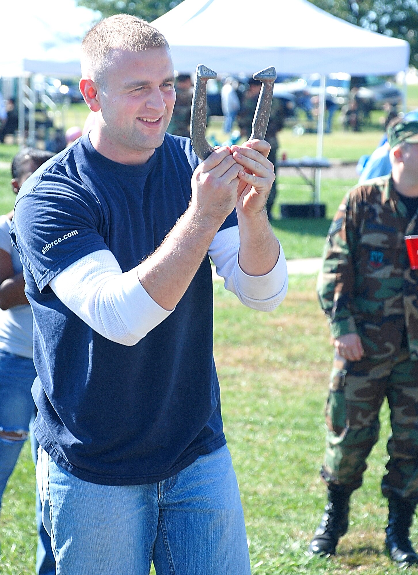 Senior Airman Andrew Carrender, 442nd  Logistics Readiness Squadron, takes careful aim as he prepares to throw a horseshoe at the 442nd Family Appreciation Day Oct. 14, 2007. Airman Carrender is an Air Force reservist assigned to the 442nd Fighter Wing at Whiteman AFB, Mo. (US Air Force photo/Staff Sgt. Tom Talbert)