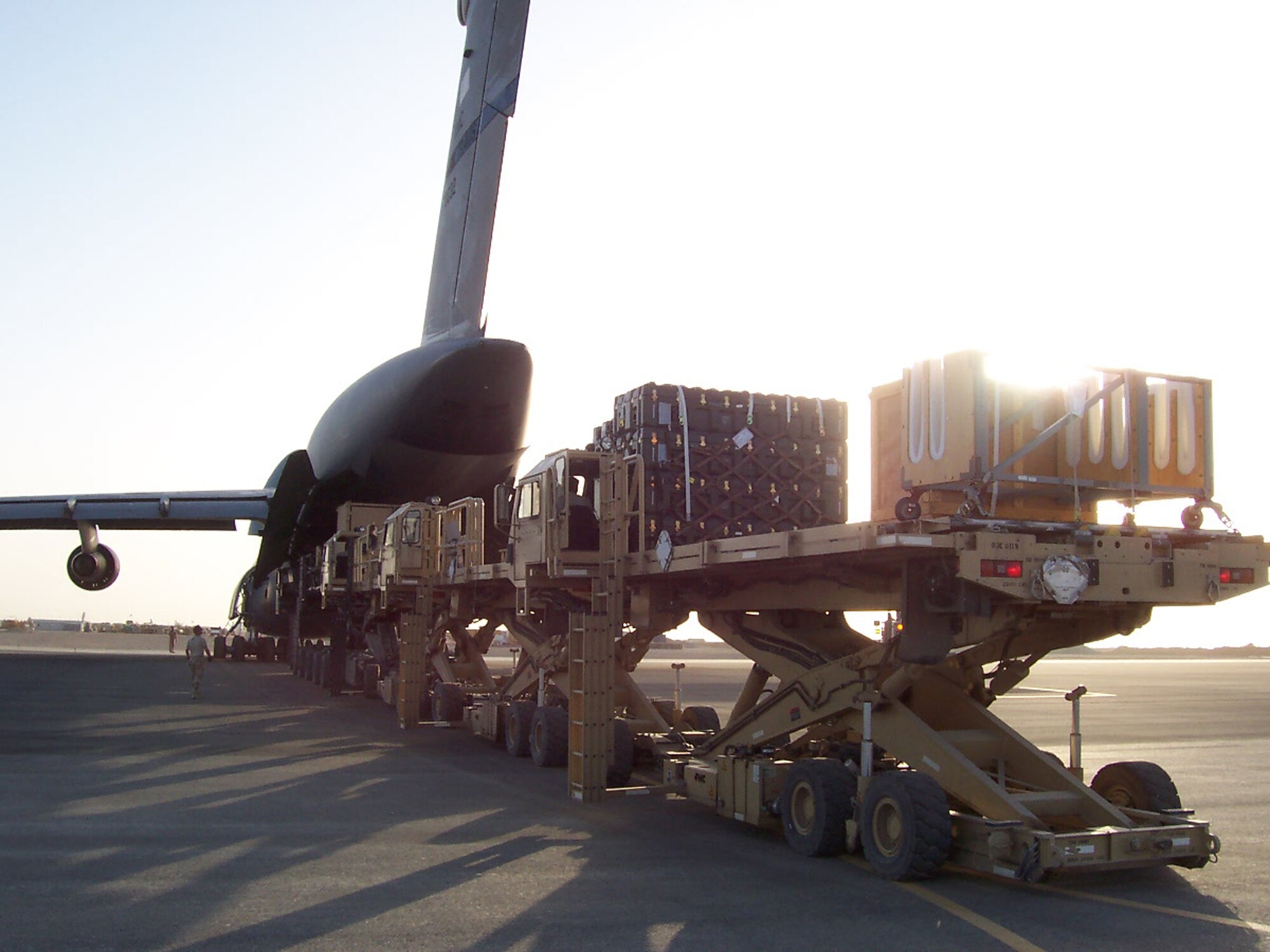 An Air Force C-5 Galaxy unloads its cargo at tha base in Southwest Asia in Sept.  The cargo will be used in the deployability test of an Air Force MQ-9 Reaper.  The test was performed by the Air Force Operational Test and Evaluation Center Detachment 5 and the 31st Test and Evaluation Squadron.  (U.S. Air Force photo)