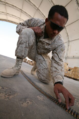 AL TAQADDUM, Iraq (Nov. 6, 2007) ? Lance Cpl. Robert J. Hagins inspects and counts ammunition to ensure it is serviceable at the ammunition supply point here Nov. 6.  Marines at the ASP provide units throughout Al Anbar Province with ground-combat munitions for small arms, tanks and artillery weapons among other things.  Hagins is an ammunition technician and Atlanta native with Ammunition Detachment, Supply Company, 2nd Supply Battalion, 2nd Marine Logistics Group (Forward).