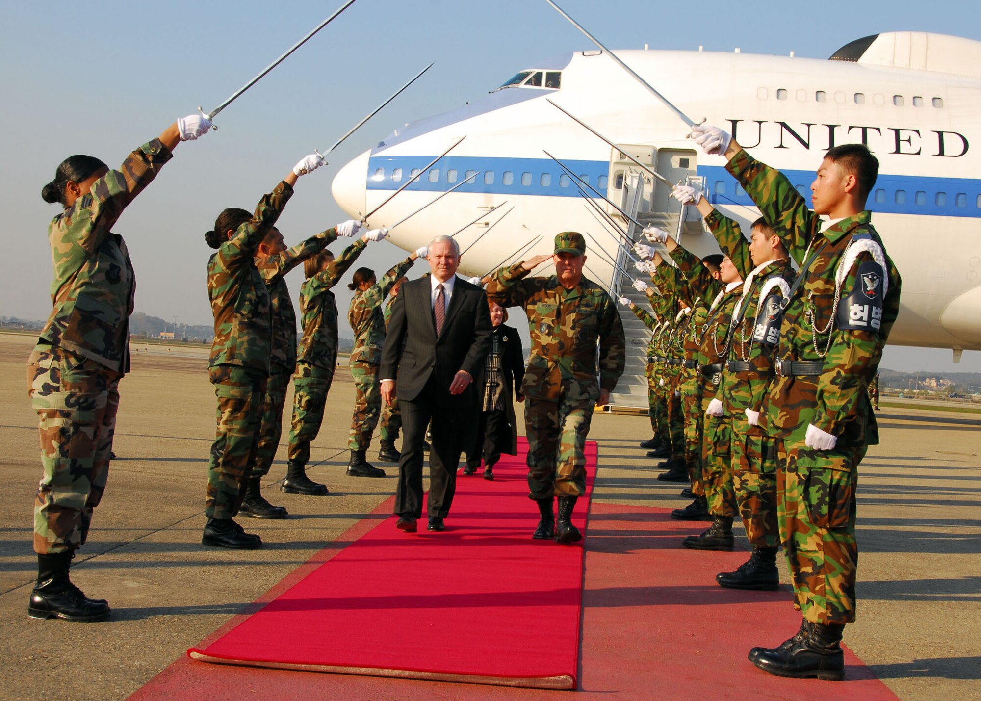 OSAN AIR BASE, Republic of Korea -- Secretary of Defense Robert M. Gates and Air Force Lieutenant General Stephen G. Wood, 7th Air Force Commander walk through an honor cordon upon Gates arrival at Osan AB, Republic of Korea, Nov. 6, 2007(U.S. Air Force photo by Staff Sgt Ronnie Hill)