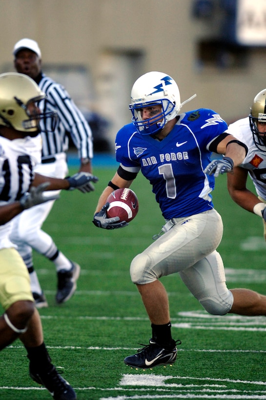 Falcon z-back Chad Hall races through the Army defense during Air Force's 30-10 win over the Black Knights Nov. 3 at Falcon Stadium in Colorado. Hall carried a career-high 34 times for an Academy record 275 yards rushing, an average of 8.1 yards per carry. (U.S. Air Force photo/Mike Kaplan)
