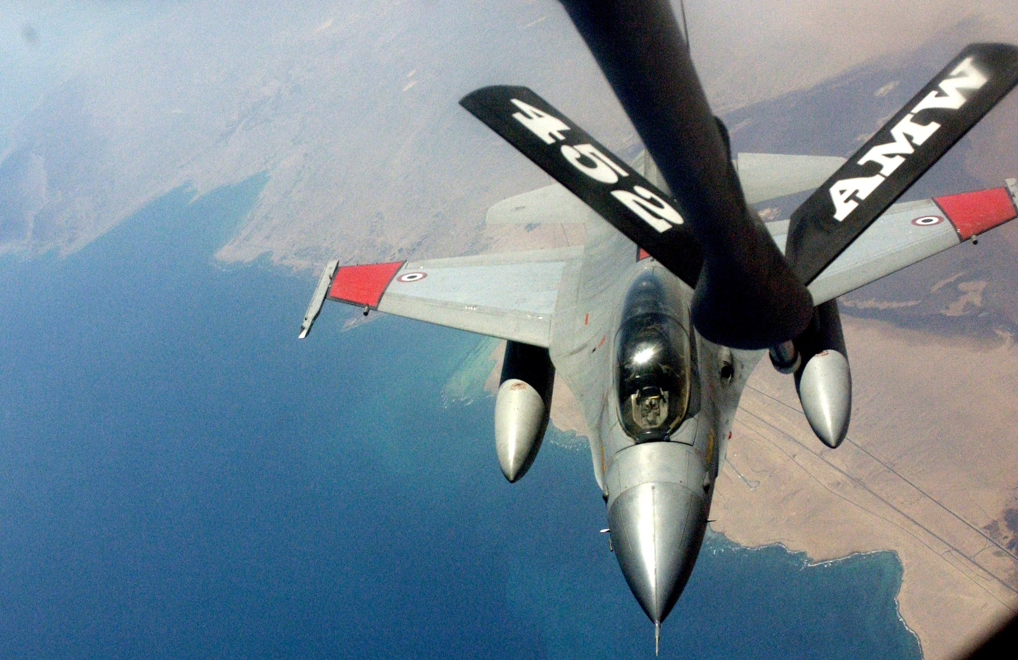 An Egyptian air force F-16 Fighting Falcon prepares to make contact with a KC-135 Stratotanker from March Air Reserve Base, Calif., during inflight refueling training.  A contingent of reservists from the 336th Air Refueling Squadron at March ARB are providing aerial refueling training for Egyptian pilots.   (U.S. Air Force photo/Staff Sgt. Amy Abbott)