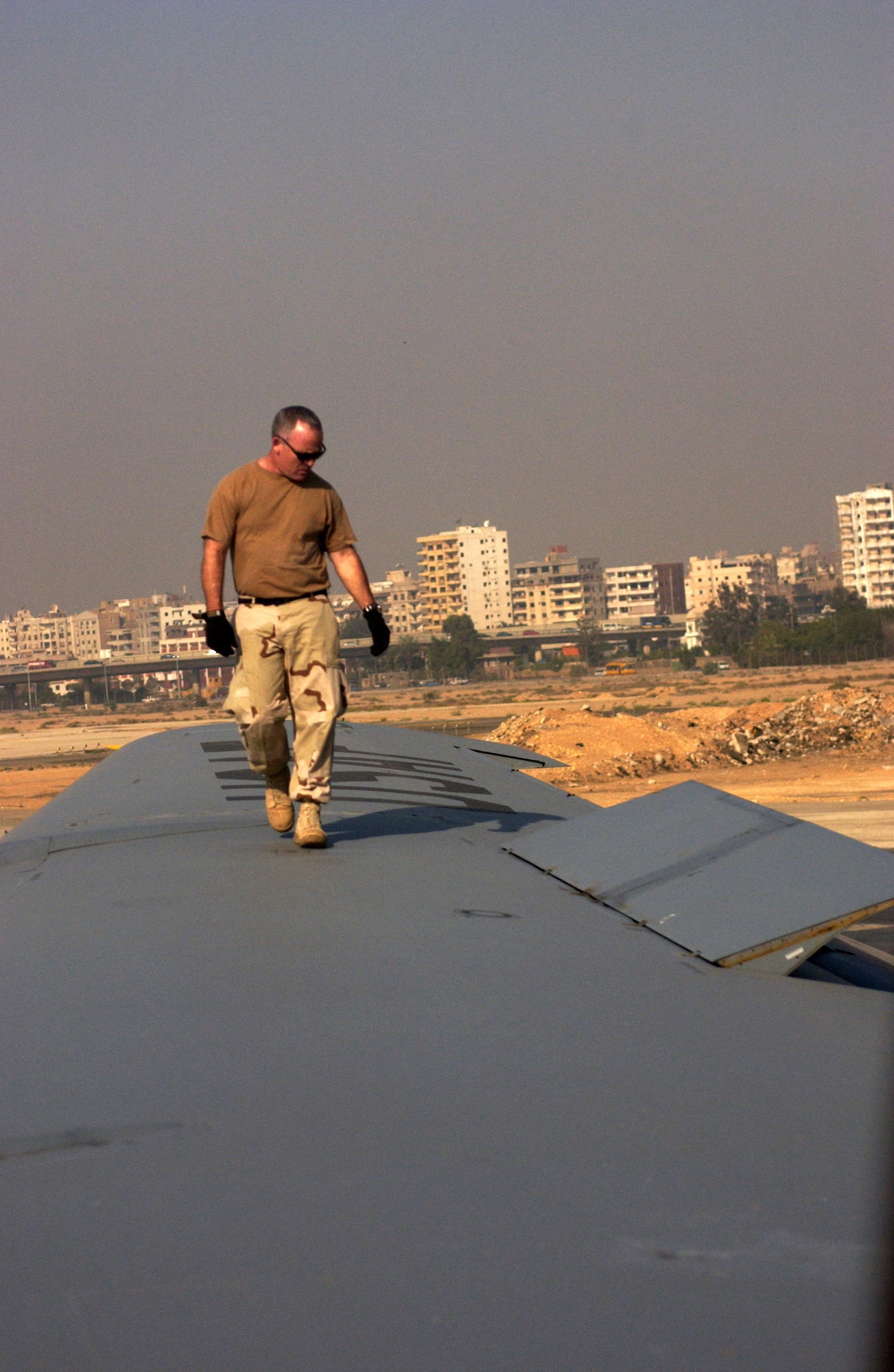 Master Sgt. Rich Grainger inspects the wing of a KC-135 Stratotanker before takeoff at the Cairo airport in Egypt.  A contingent of reservists from the 336th Air Refueling Squadron at March Air Reserve Base, Calif., are providing aerial refueling training for Egyptian pilots.  Sergeant Grainger is a crew chief with the 752nd Aircraft Maintenance Squadron at March AFB.  (U.S. Air Force photo/Staff Sgt. Amy Abbott) 