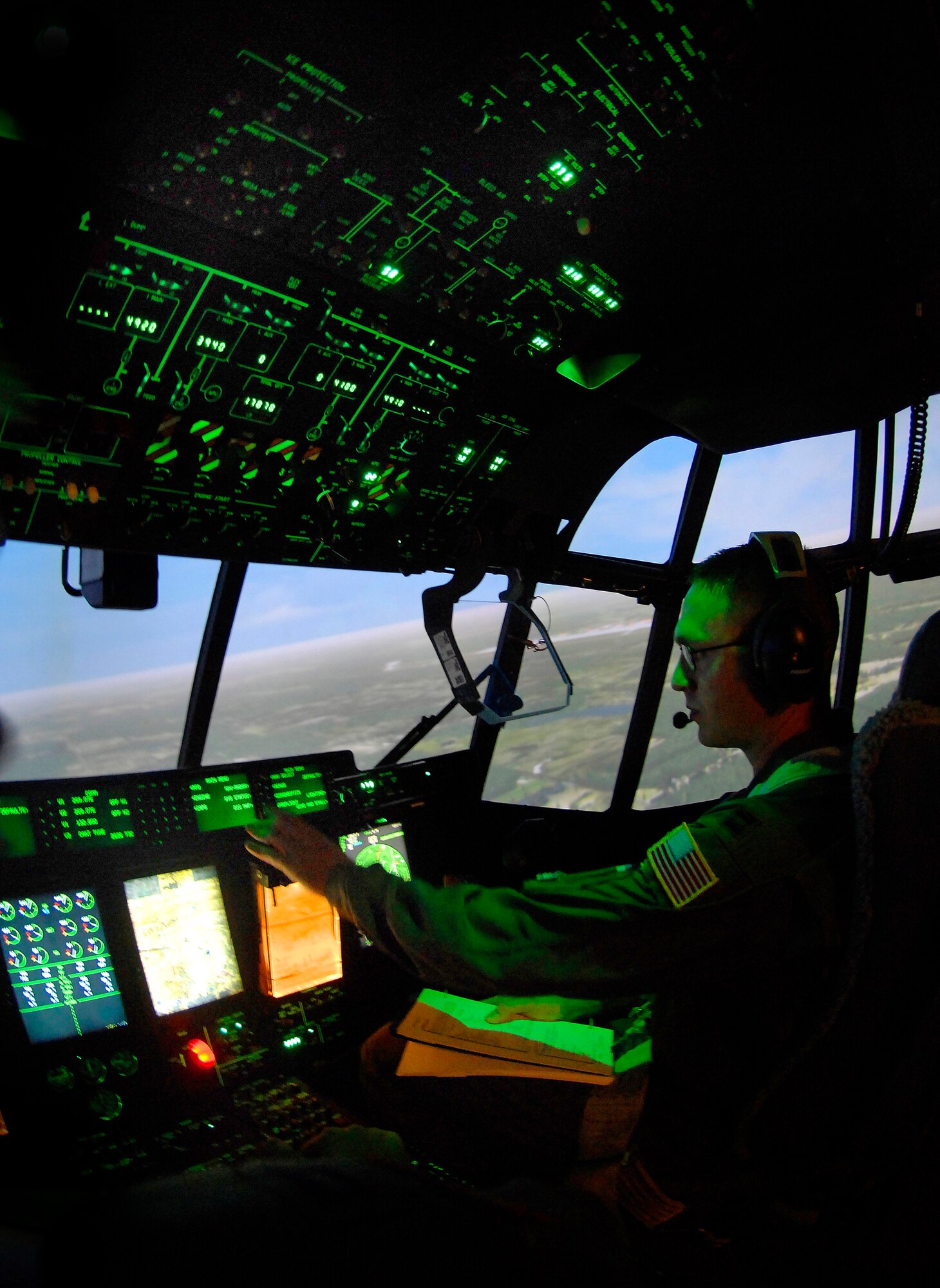 Capt. Nathan Glasscock prepares to land while training on the C-130 model simulator at Little Rock Air Force Base, Ark., on Nov. 1. Captain Glasscock is a student at the C-130 Center of Excellence. (U.S. Air Force photo/Tech. Sgt. Larry A. Simmons) 