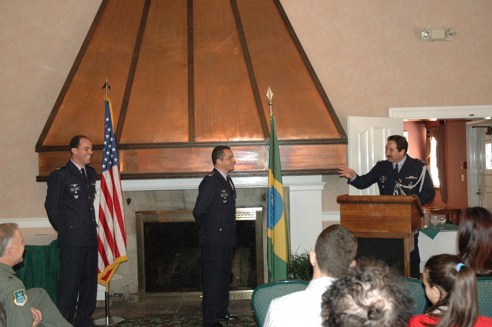 Brazilian Air Force Col. Paulo João Cury, Chief of the Brazilian Aeronautical Commission, right, makes his remarks during the ceremony marking the change of leadership in the Brazilian Air Force liaison office from Lt. Col. Gilberto Siqueira, left, to Lt. Col. Claudio Cardoso Oct. 29.  Personnel assigned to the liaison office represent their government to the Air Force Security Assistance Center here.  (Air Force photo)
