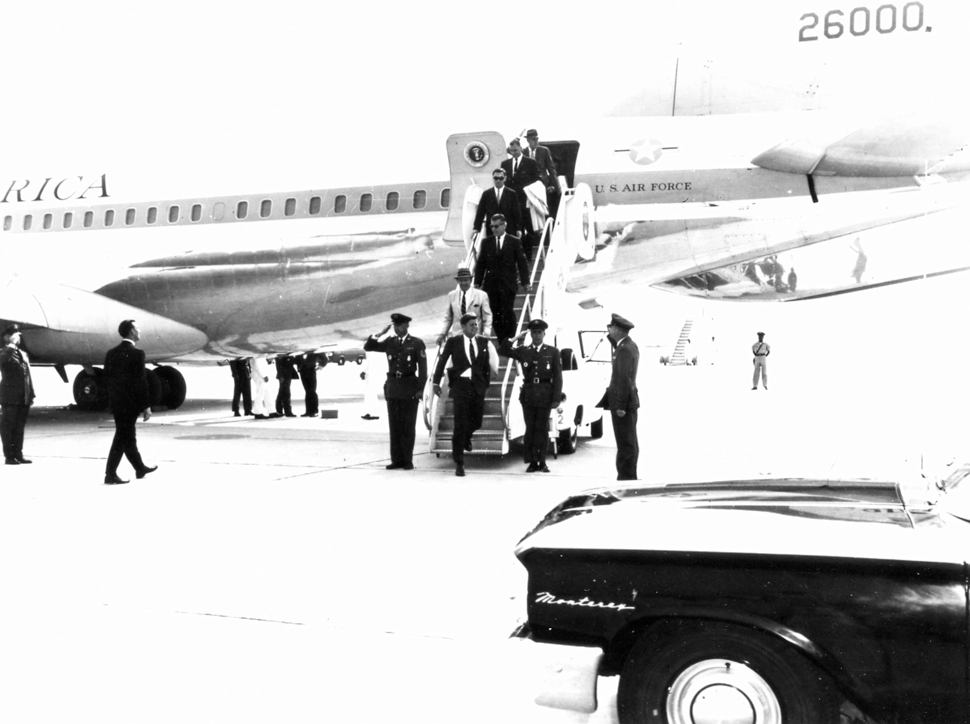 President John F. Kennedy disembarks Boeing VC-137C SAM 26000 (Air Force One). (U.S. Air Force photo)