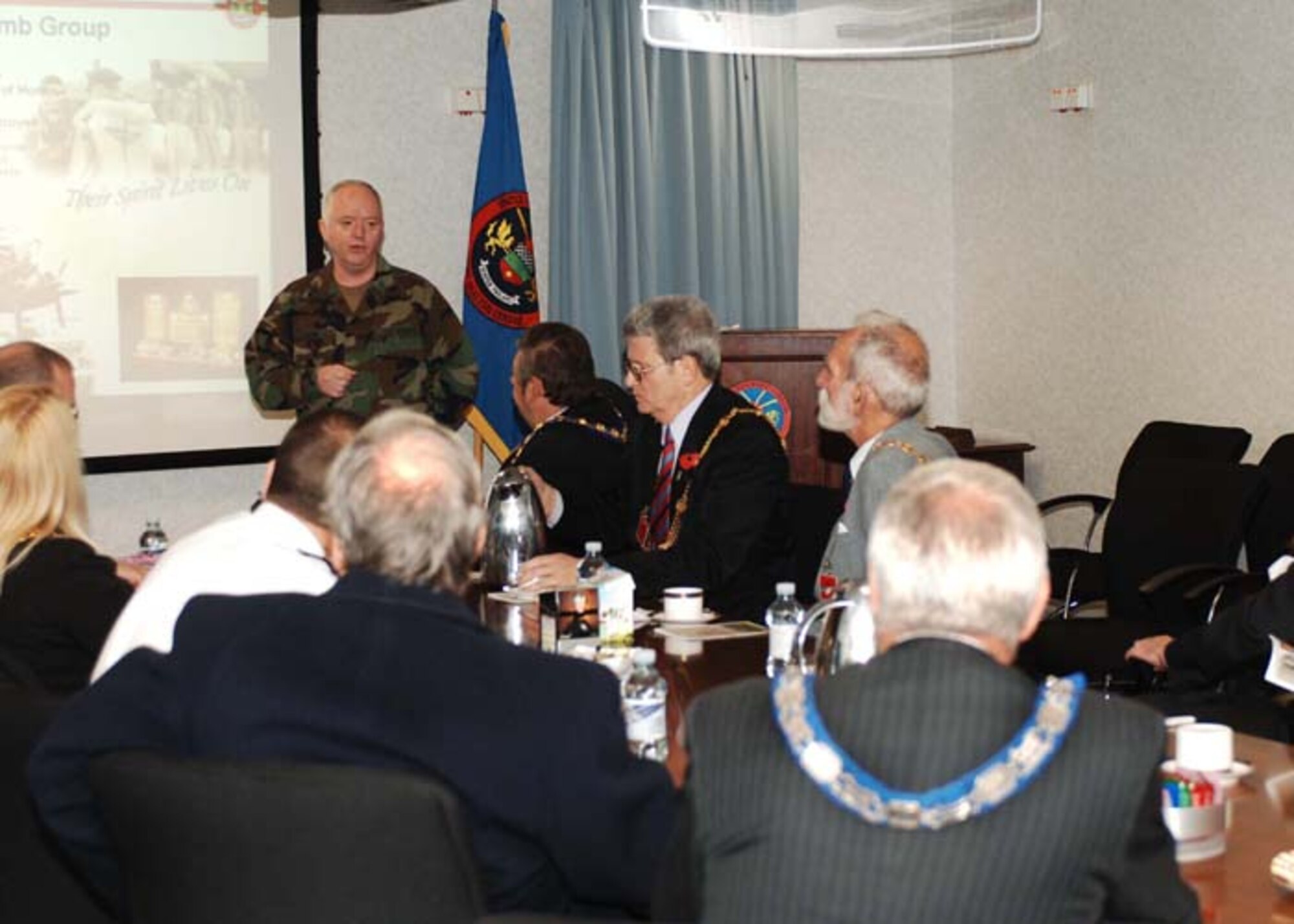 Navy Capt. Harry J. Babin briefs local British civic leaders during a tour of the US EUCOM Joint Analysis Center on November 6th.  The Civic leaders received an introduction to the 423rd Air Base Group, JAC,  and the Intelligence Fusion Centre in support of NATO as part of a day-long orientation to the Tribase area and its contributions to the community and to the global war on terror.  (U.S. Air Force Photo by Tech. Sgt. Casey J. Martin)