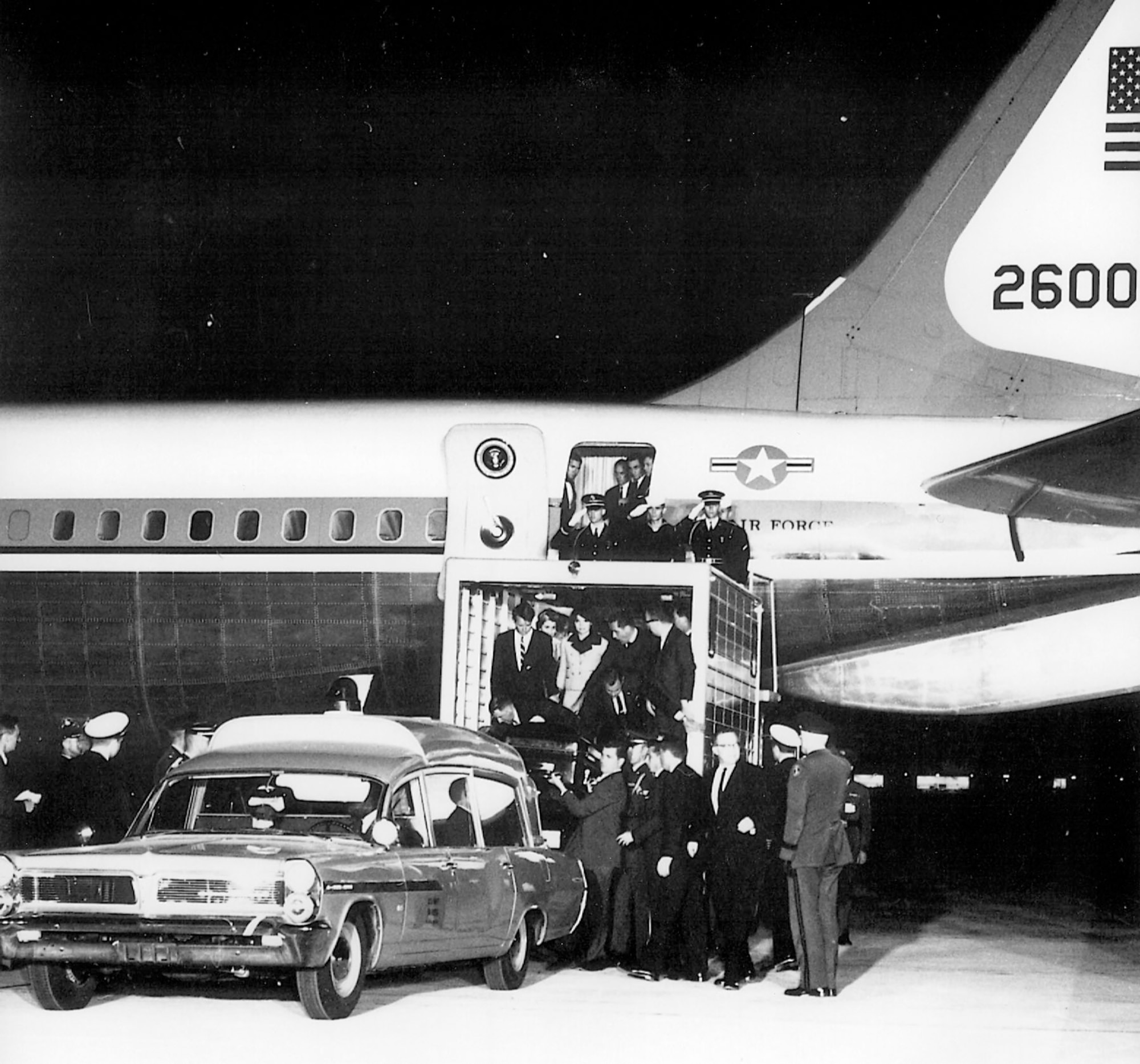 President John F. Kennedy's casket is unloaded from Boeing VC-137C SAM 26000 (Air Force One) after his assassination in Dallas, Texas, in November 1963. (U.S. Air Force photo)
