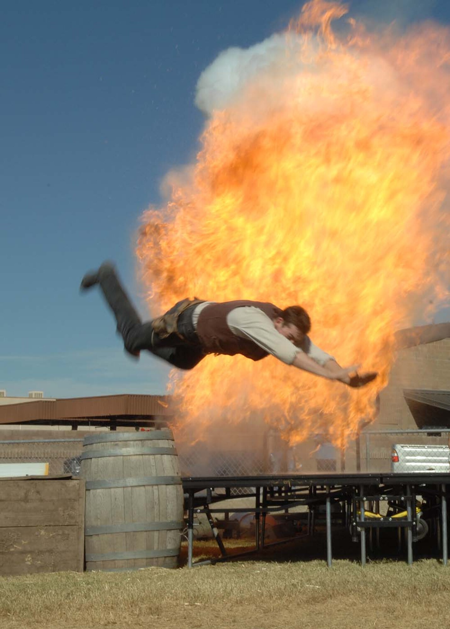 Wyatt Campbell, a performer from Pinnacle Peak, dives over boxes to avoid an explosion during a gun show Oct. 27, 2007 during the DM-50 picnic at Bama Park.  (U.S. Air Force photo by Senior Airman Christina D. Kinsey)