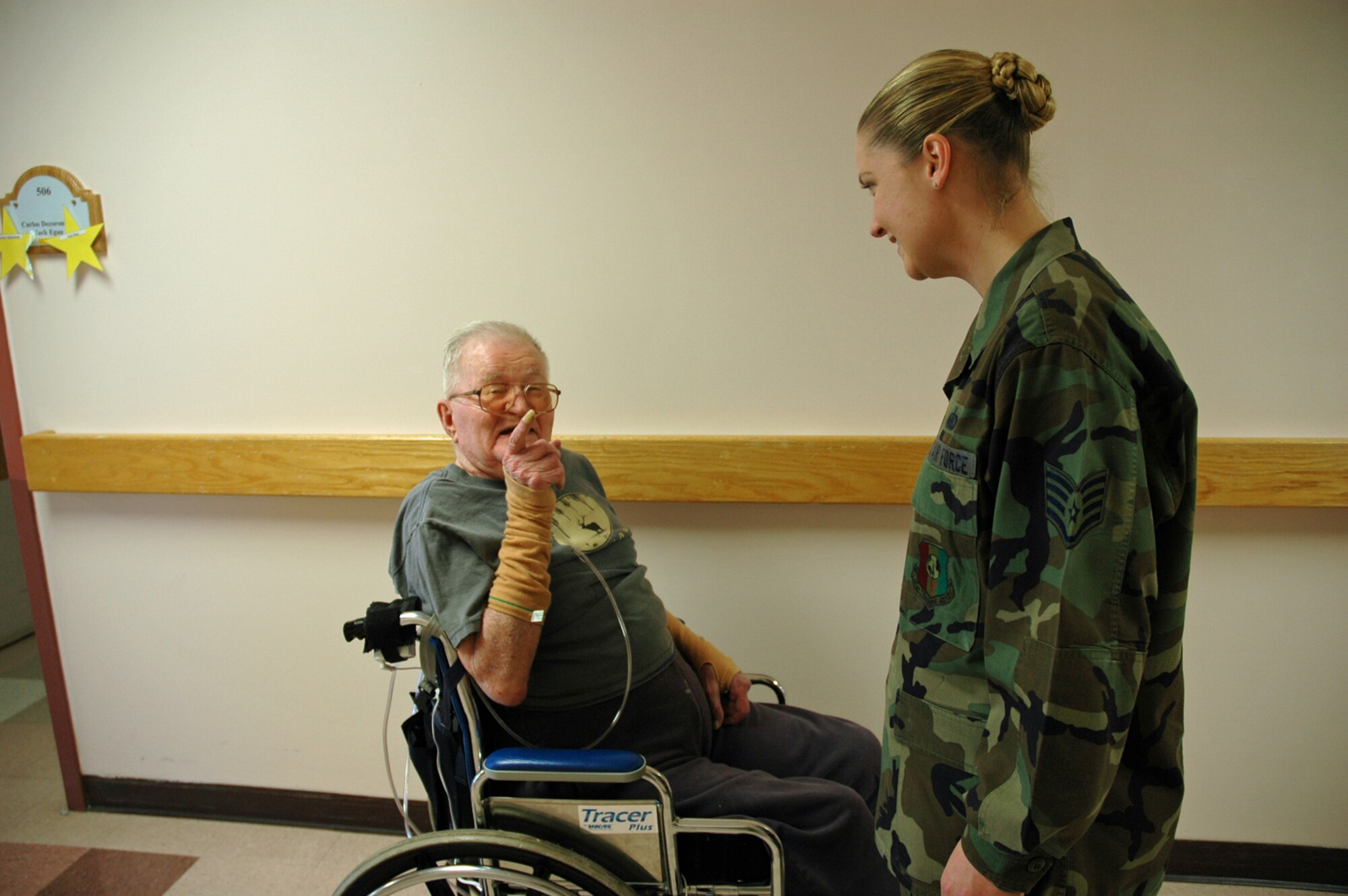 Peter Baerg, a retired Soldier, tells Staff Sgt. Desiree Pogue, 392nd Training Squadron Det. 1, about his role in the Battle of the Bulge. (U.S. Air Force photo by Staff Sgt. Stacey Haga)
