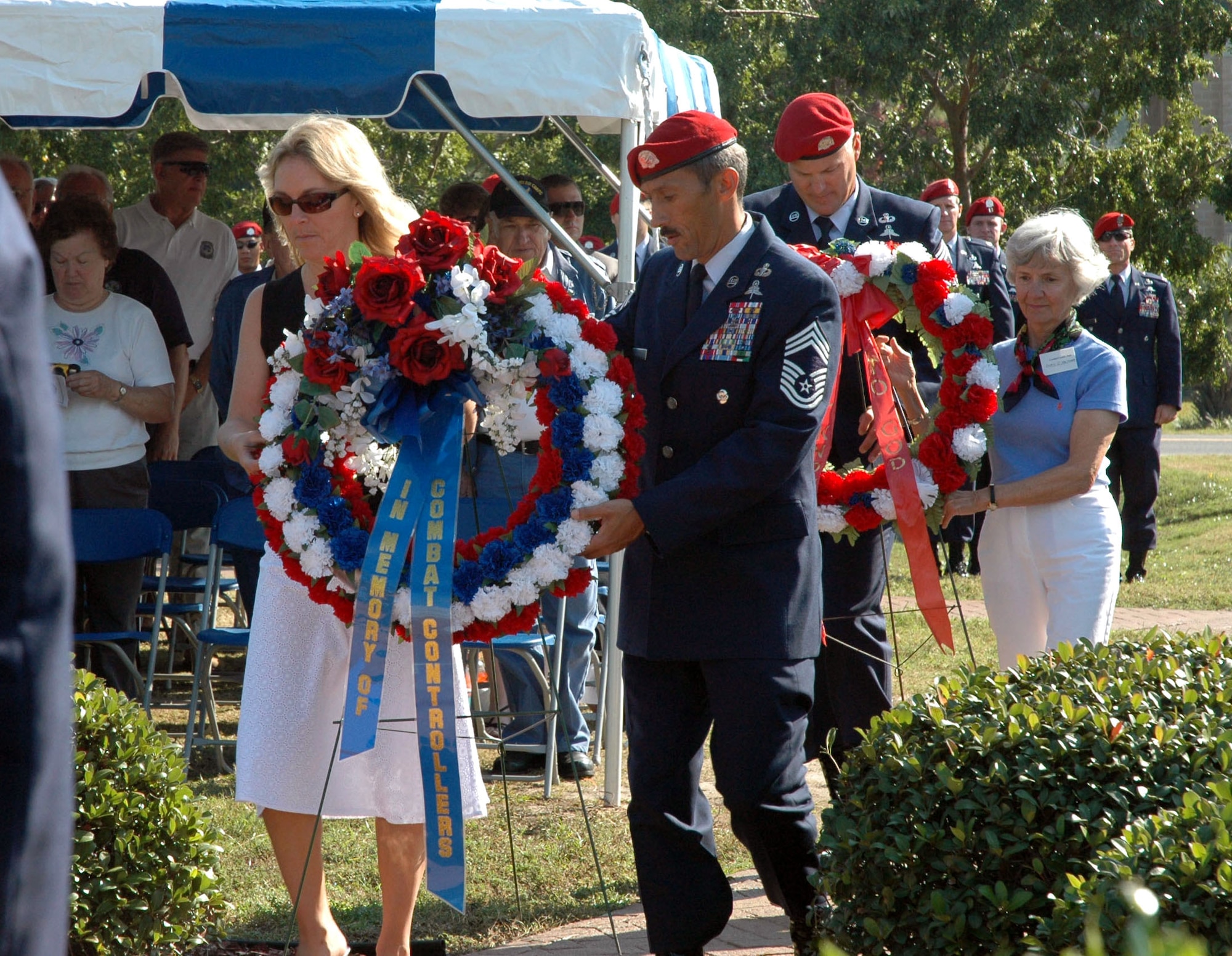 Valerie Chapman (left), widow of fallen combat controller and Air Force Cross recipient Tech. Sgt. John Chapman, and Doris Maitland, sister of Andre Guillet, listed as missing in action from the Vietnam War, lay wreaths in honor of all the fallen controllers during the Combat Control Association reunion Nov. 3 at Hurlburt Field, Fla. Assisting the family members are Chief Master Sgt. Michael Ramos from the 720th Special Tactics Group, and Chief Master Sgt. Timothy Hoye from the 23rd Special Tactics Squadron. (U.S. Air Force photo/Dawn Hart)