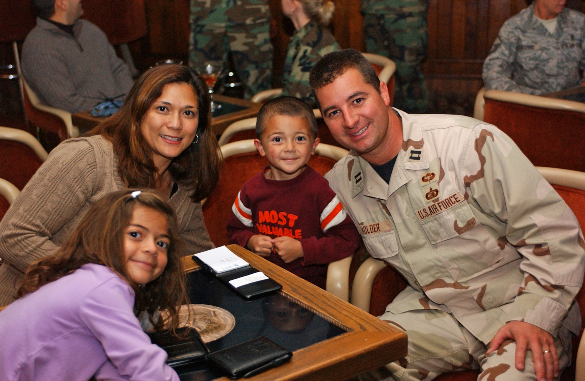Capt. Jason Holder, his wife, Lydia, and their children Alyssa, 7, and Ethan, 5, celebrate at the Deployed Airmen Welcome Home Dinner Oct. 29 at The Club. (U.S. Air Force photo by Lynn Sleeth)