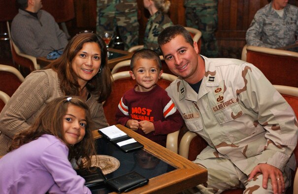 Capt. Jason Holder, his wife, Lydia, and their children Alyssa, 7, and Ethan, 5, celebrate at the Deployed Airmen Welcome Home Dinner Oct. 29 at The Club. (U.S. Air Force photo by Lynn Sleeth)