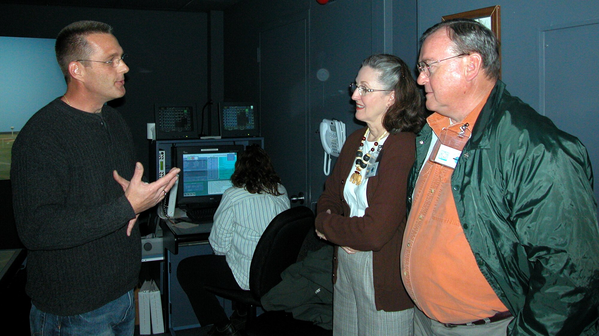 GRISSOM AIR RESERVE BASE, Ind., -- Francis and Cheryl Jaquay, members of the Grissom Community Council, receive instructions from Robert Moore, the chief of training for radar approach control, before taking control of the flight line on the control tower simulator. The simulator is located in the radar approach control building. The Grissom Community Council participated in a base tour Nov. 3, where they were able to explore different opperations on base. (U.S. Air Force photo/ Senior Airman Carl Berry)