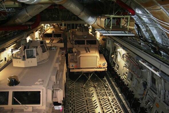 A C-5, loaded with three Mine Resistant Ambush Protected vehicles headed to a Marine Corps unit fighting in the Central Command Area of Operations, recently stopped at Morón Air Base. The base, operated by 496th Air Base Squadron, 86th Airlift Wing, hosted 75 members of the 725th Air Mobility Squadron stationed at Rota Naval Air Station, Spain in October while their runway was closed due to runway maintenance. During their five-day operation, they serviced more than 40 C-5’s and C-17’s loaded with cargo and more than 300 passengers. ( Courtesy Photo)