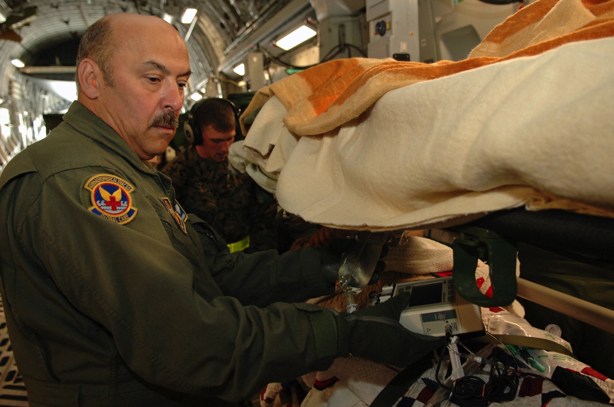 Master Sgt. Daniel Kibe works on aeromedical evacuation flights on Ramstein. (Photo by Airman 1st Class Marc I. Lane)