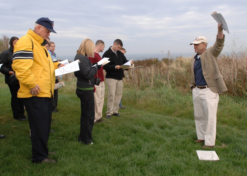 Army Col. (ret) Peter Herrly leads Lt. Gen. Rod Bishop, 3rd Air Force commander, and 24 Airmen on a Normandy staff ride. (Courtesy photo)