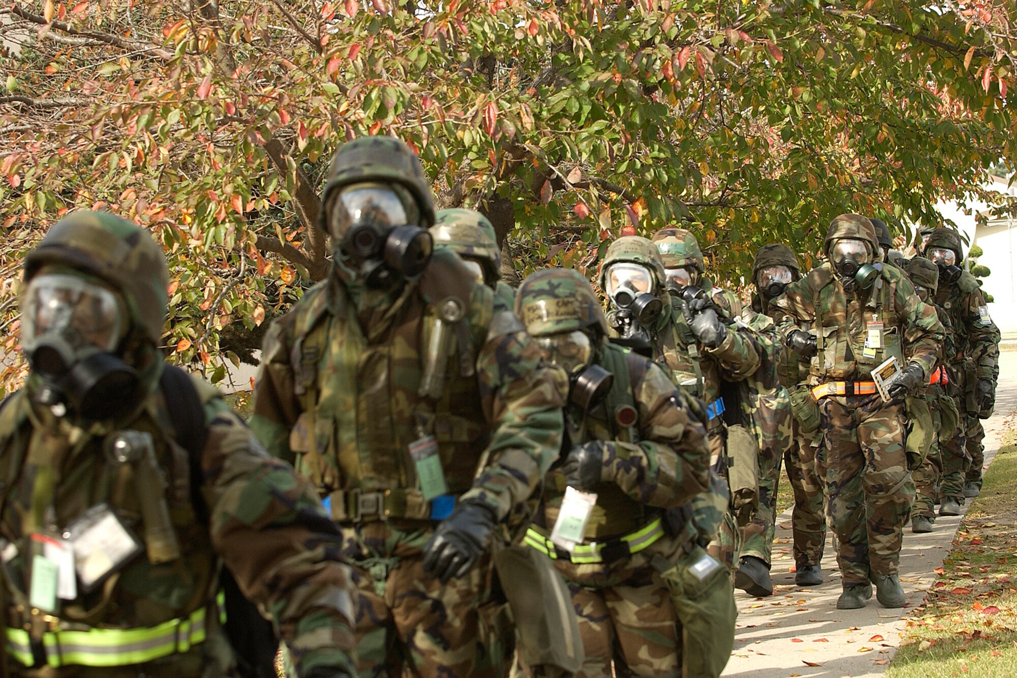 KUNSAN AIR BASE, South Korea--Members of the 8th Fighter Wing leave their designated area  to a more secured location during the Peninsula Operational Readiness Exercise here Nov. 6. The exercise is conducted to ensure members of the Wolf Pack remain ready to execute its mission of "Defending the Base, Accepting Follow on Forces and Taking the Fight North." (U.S. Air Force photo/Senior Airman Giang Nguyen)

                               