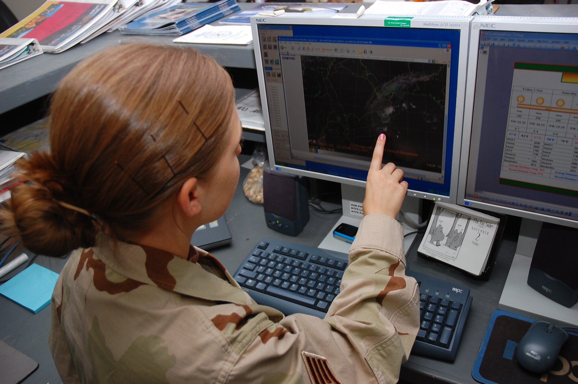 SOUTHWEST ASIA -- Staff Sgt. Tricia Williamson, 386th Expeditionary Operations Group weather forecaster, tracks a tropical storm in the Arabian Sea Nov. 2 here.  Sergeant Williamson is deployed from Royal Air Force Mildenhall, England. (U.S. Air Force photo by Staff Sgt. Tia Schroeder)
