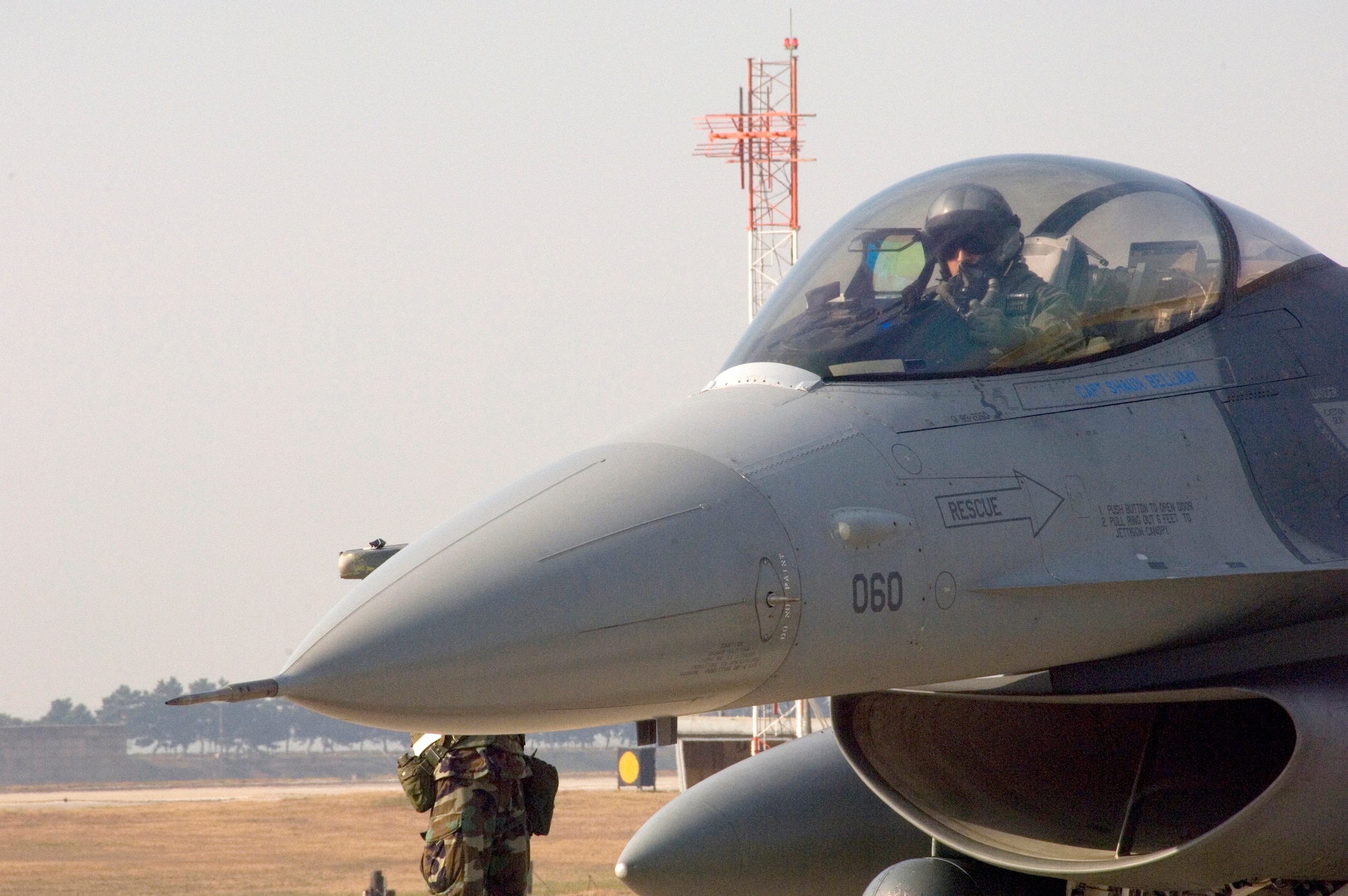 KUNSAN Air Base, South Korea -- An F-16 pilot waits for final clearance to take off during a Peninsula Operational Readiness Exercise here Nov. 7.  The PENORE is conducted to ensure members of the Wolf Pack remain ready to execute its mission of “Defending the Base, Accepting Follow on Forces and Taking the Fight North.”   (U.S. Air Force Photo/Master Sgt.Jack Braden)
