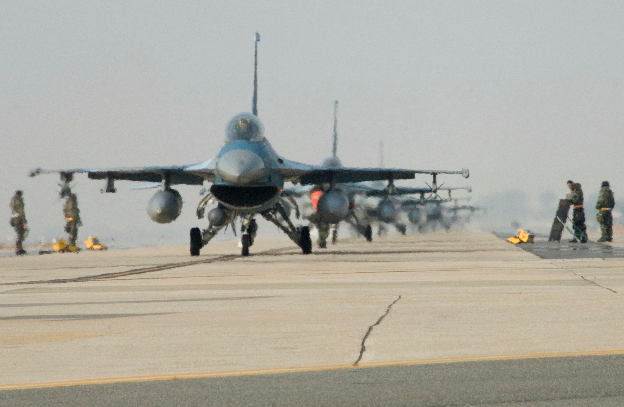 KUNSAN AIR BASE, South Korea --  An F-16 pilot waits for final clearance to take off during a Peninsula Operational Readiness Exercise here Nov. 7. The PENORE is conducted to ensure members of the Wolf Pack remain ready to execute its mission of “Defend the Base, Accept Follow on Forces and Take the Fight North.”   (U.S. Air Force Photo/Master Sgt.Jack Braden)