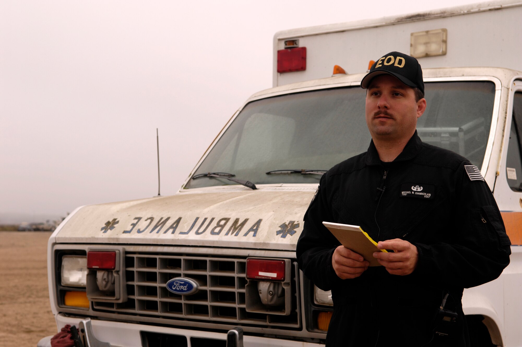 VANDENBERG AIR FORCE BASE, Calif. -- Tech. Sgt. Michael Chamberlain lists information and material on an ambulance prior to its detonation by 500 pounds of explosives for use in the Federal Bureau of Investigations post-blast investigator training on Nov. 6. Sergeant Chamberlain is an Explosive Ordnance Disposal technician with the 30th Civil Engineer Squadron. Federal, state and local law enforcement officers involved in bomb crime-scene investigations participate in this one-week course which places an emphasis on the identification and collection of fragmented and mutilated bomb components. (U.S. Air Force photo/Airman 1st Class Christian Thomas)

