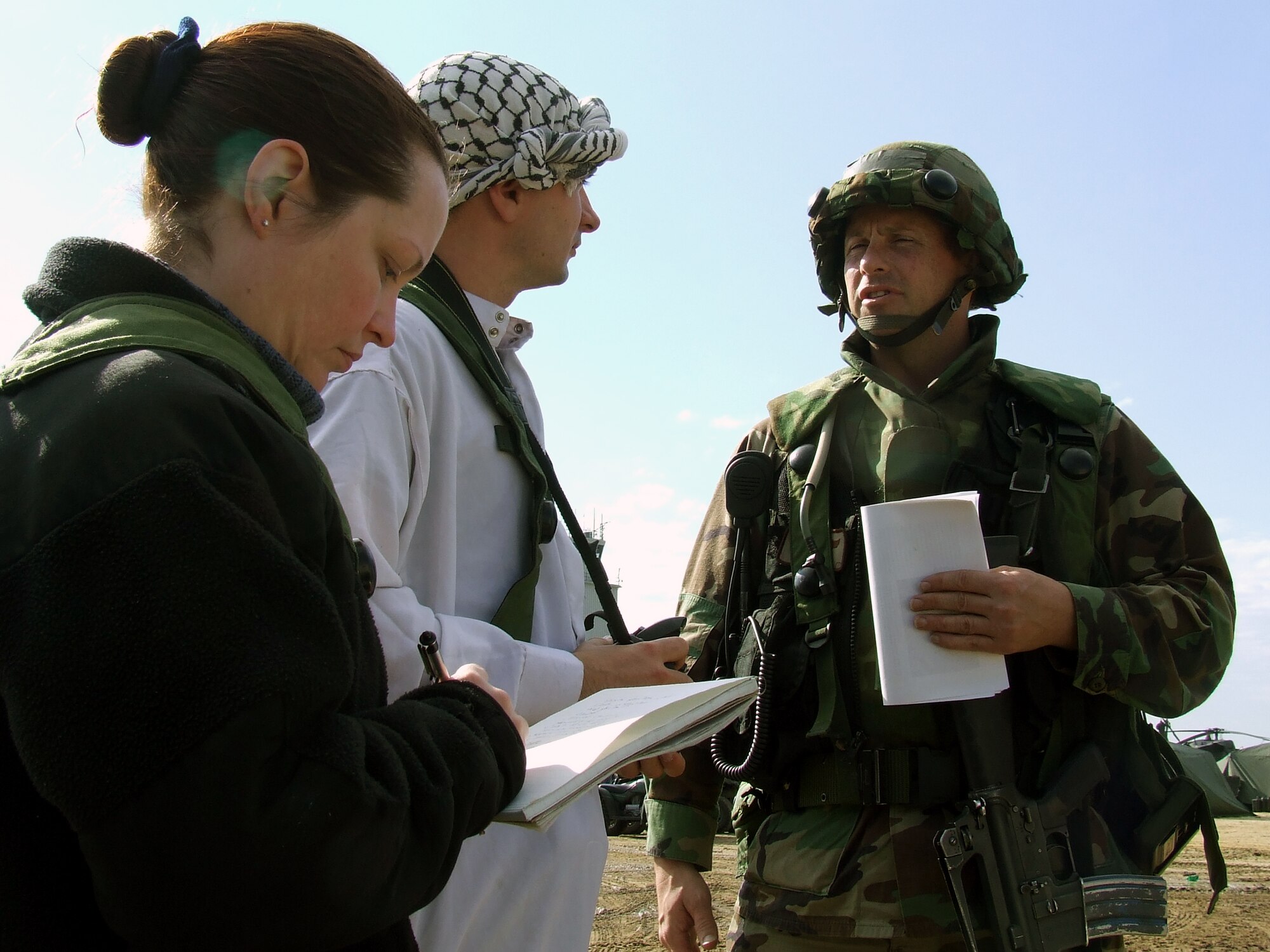 Lt. Col. Kyle Voigt, operations officer for the 818th Contingency Response Group, McGuire Air Force Base, N.J.,talks to "local media" during a scenario for Air Force Exercise Eagle Flag 08-1 at Naval Air Engineering Station Lakehurst, N.J., Oct. 20.  The exercise, coordinated by the U.S. Air Force Expeditionary Center's 421st Combat Training Squadron, tests and trains more than 400 Airmen in expeditionary combat support career fields during six exercises every year.  The CRG unit is the first unit in the field during every exercise.  (U.S. Air Force Photo/Tech. Sgt. Scott T. Sturkol)