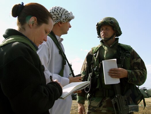 Lt. Col. Kyle Voigt, operations officer for the 818th Contingency Response Group, McGuire Air Force Base, N.J.,talks to "local media" during a scenario for Air Force Exercise Eagle Flag 08-1 at Naval Air Engineering Station Lakehurst, N.J., Oct. 20.  The exercise, coordinated by the U.S. Air Force Expeditionary Center's 421st Combat Training Squadron, tests and trains more than 400 Airmen in expeditionary combat support career fields during six exercises every year.  The CRG unit is the first unit in the field during every exercise.  (U.S. Air Force Photo/Tech. Sgt. Scott T. Sturkol)