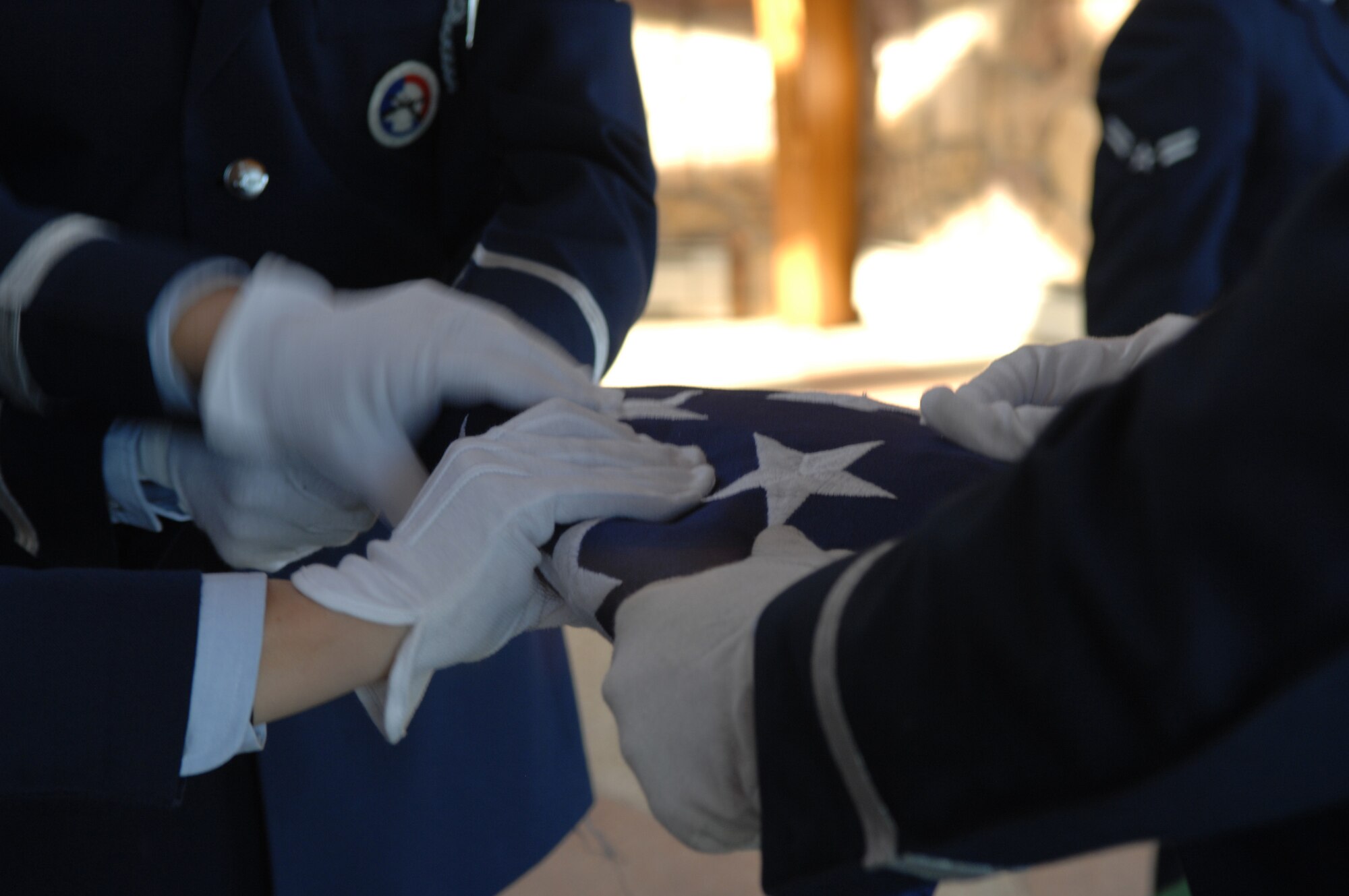 The 28th Bomb Wing Honor Guard completes the flag folding portion of a retiree funeral at the Black Hills National Cemetery Nov.1.  This funeral detail is the first seven-person funeral to be performed by the 28th Bomb Wing Honor Guard. 
(U.S. Air Force photo/Airman First Class Anthony Sanchelli)