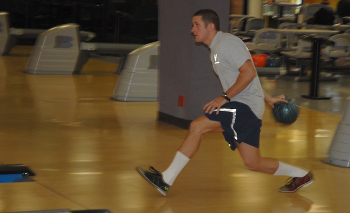 Airman 1st Class Joseph VonDohlen, 15th Airlift Squadron, bowls with his squadron at Starlifter Lanes before the fun run. (U.S. Air Force photo/Airman Melissa White)