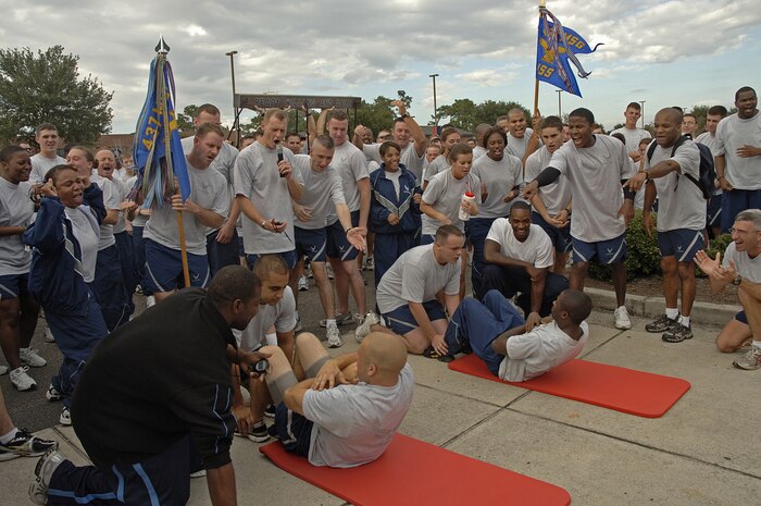Facing off for the Spirit Award after the October 2007 commander's fun run was Senior Airman Clifford Hartley, 437th Security Forces, and Airman Carey Grant, 437th Civil Engineer Squadron, First Term Airmen Center students, while their squadrons cheered them on.  (U.S. Air Force photo/Staff Sgt. April Quintanilla)