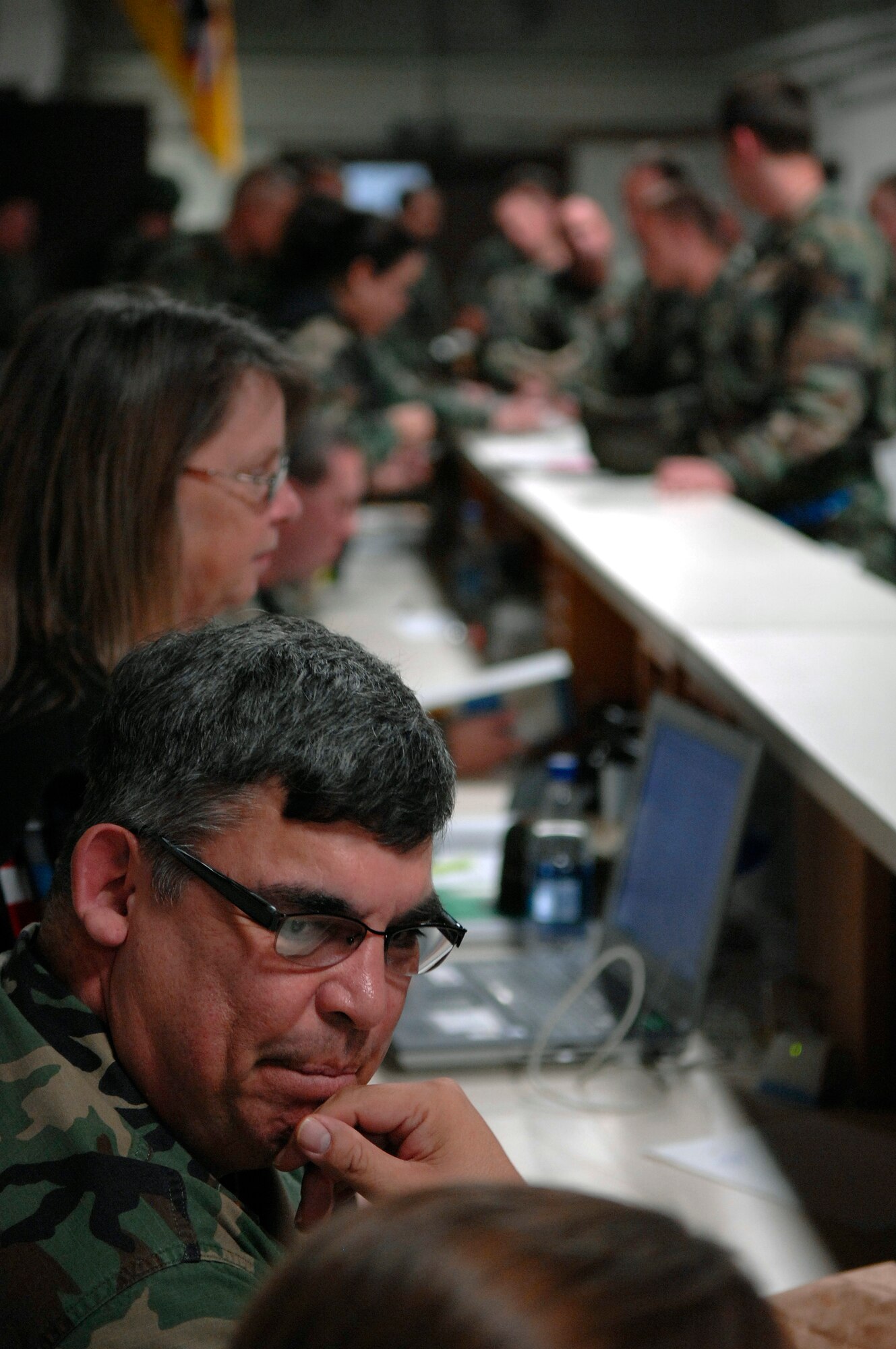 U.S. Air Force Airmen from the 28th Bomb Wing process through a simulated deployment line during Badlands Express 07-06, an Operational Readiness Exercise (ORE), at Ellsworth Air Force Base, S.D., Sept. 10, 2007.  Ellsworth is conducting this ORE in preparation for an upcoming Operational Readiness Inspection in November.  (U.S. Air Force photo by SSgt Michael B. Keller)(Released)