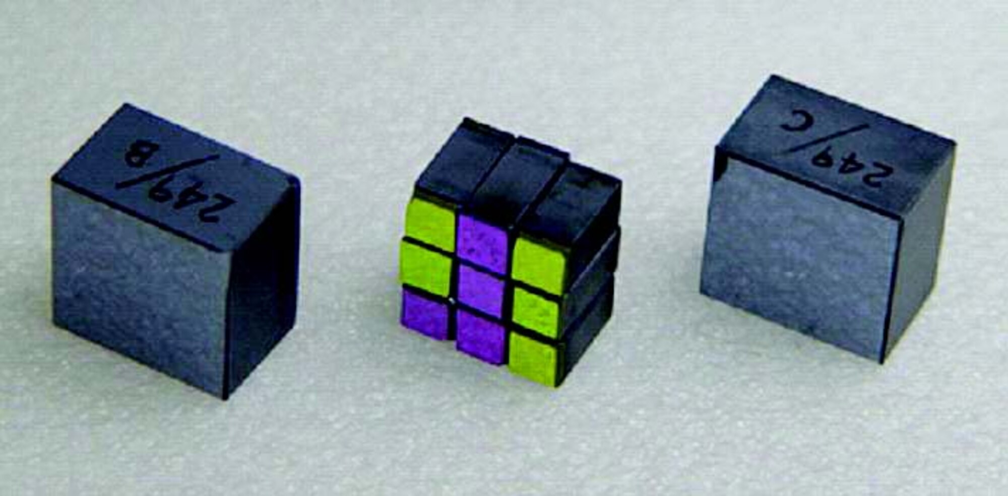New large-aperture nonlinear optical crystal parts, with the center image showing nine standard-sized crystal parts stacked into a cube