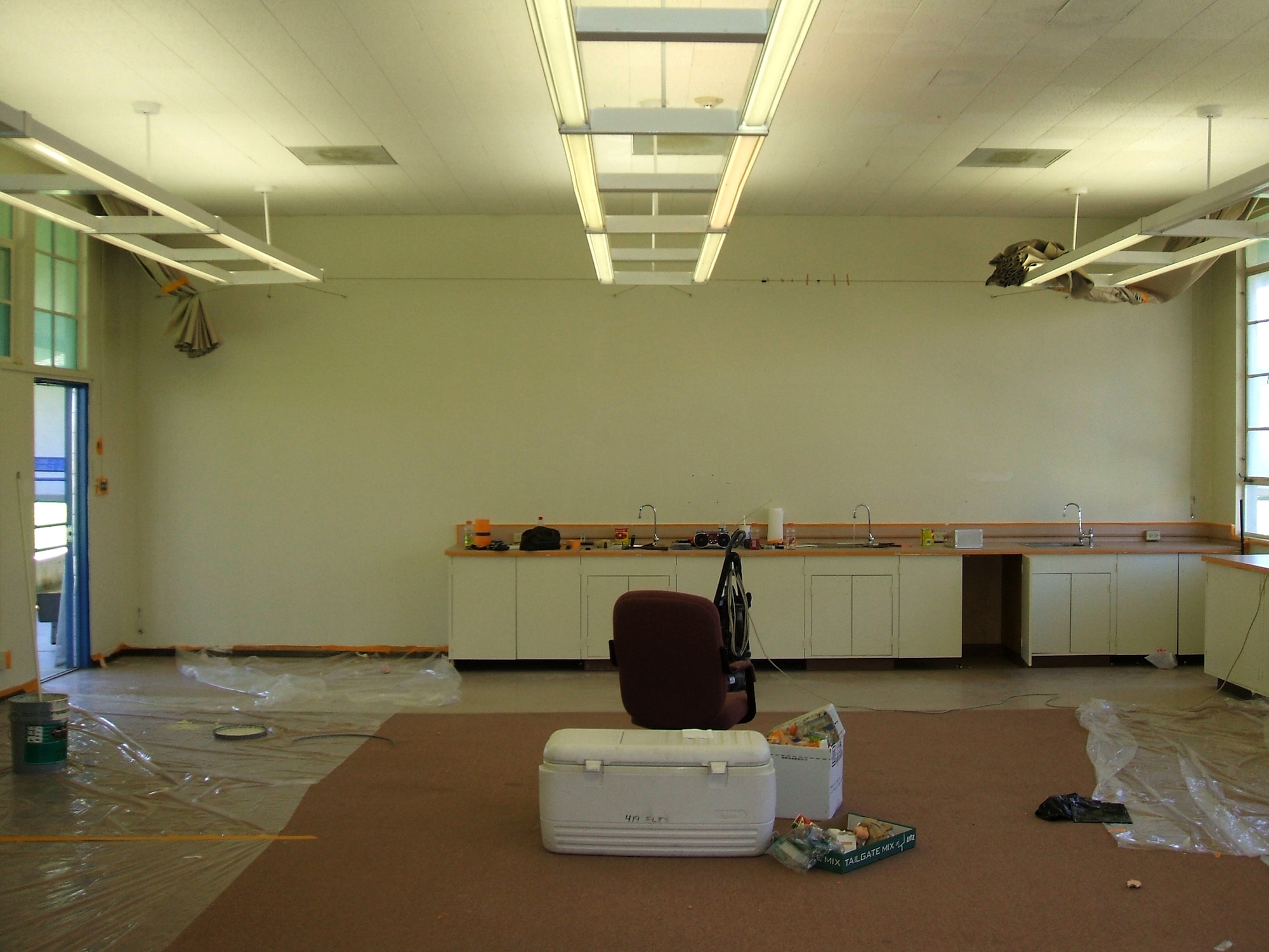 Before renovation, the "Howlin' Dawg" room at the Center of Excellence was an empty classroom with holes in the walls, dilapidated paint and water-stained windows. The 412th Aircraft Maintinence Squadron spent two months and 1,000 volunteer hours transforming the room into a place suitable for local students. (Courtesy photo)