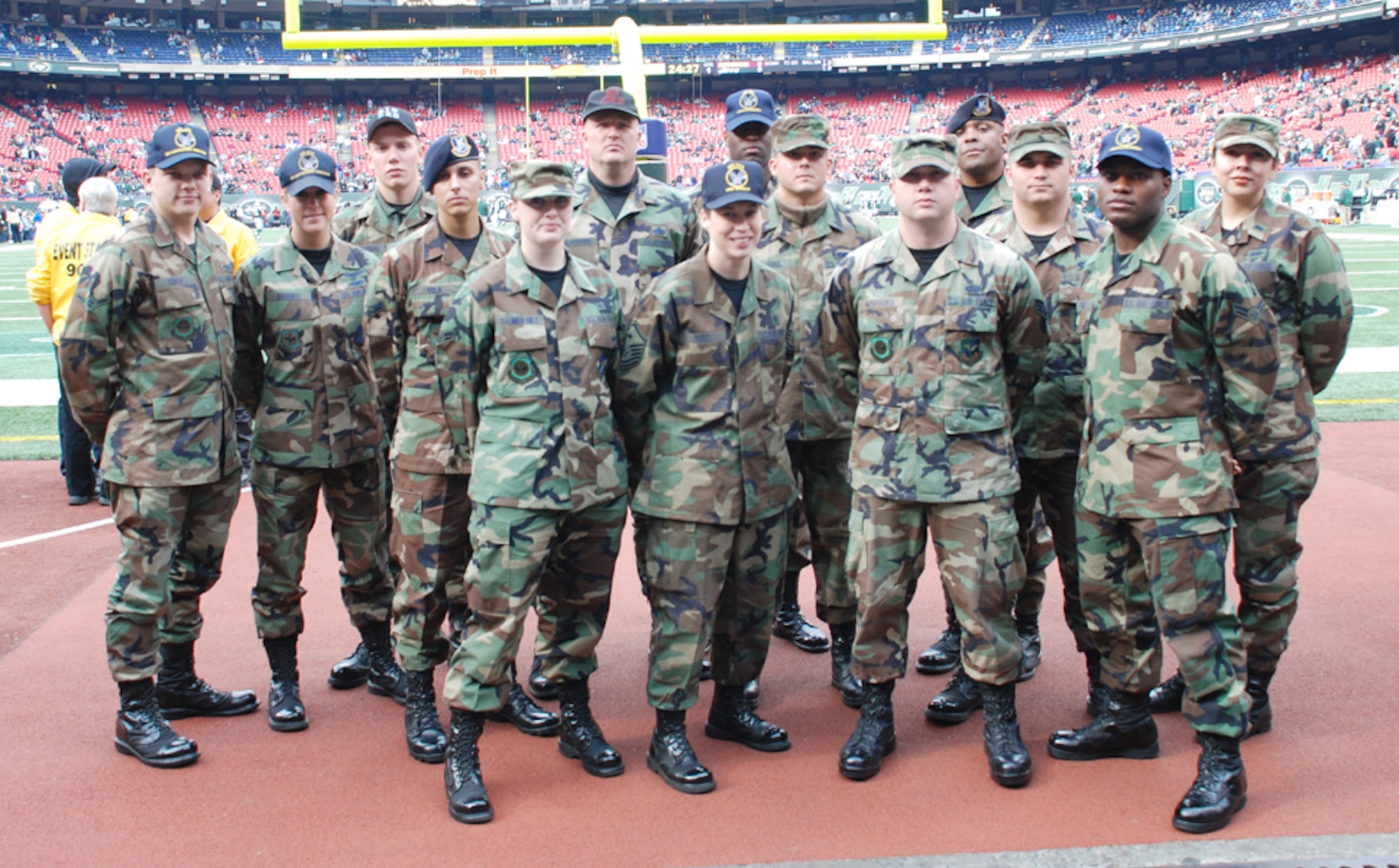 McGuire Airmen prepare to enter the stadium at the Nov. 4 NFL game between the N.Y. Jets and Washington Redskins. Servicemembers from each of the five military branches unfurled an enormous American Flag as part of the Jets' eighth annual Military Appreciation Day. Fifteen Team McGuire members participated in the event, which honored all servicemembers, as well as Navy Lt. Michael Murphy, a SEAL who lost his life in Afghanistan two years ago and was posthumously awarded the Medal of Honor. (U.S. Air Force photo / Airman 1st Class Rebekah Phy)