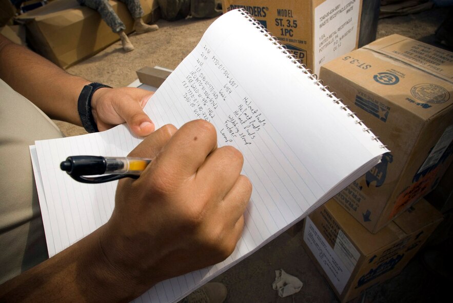 Tech. Sgt. Richard Carditl records the product name, quantity and national stock number of the items inside a container express Oct. 19 at Camp Corregidor, Iraq. Serviceable assets recovered from the container express are inventoried and redistributed to Army units throughout Iraq. Airmen of various career fields augment the Army in nontraditional "in-lieu-of" taskings for up to a year. Sergeant Carditl, from Material Recovery Team III with the 732nd Expeditionary Logistics Readiness Squadron, is deployed from Shriever Air Force Base, Colo. (U.S. Air Force photo/Master Sgt. John Nimmo Sr.) 