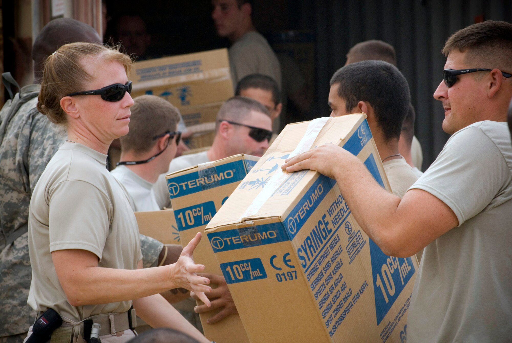 Airmen from Material Recovery Team III with the 732nd Expeditionary Logistics Readiness Squadron and Soldiers from 1st Battalion 9th Infantry Regiment unload a container express Oct. 19 at Camp Corregidor, Iraq. Serviceable assets recovered from the container express are inventoried and redistributed to Army units throughout Iraq. Airmen of various career fields volunteer to augment the Army in nontraditional "in-lieu-of" taskings for up to a year. (U.S. Air Force photo/Master Sgt. John Nimmo Sr.) 
